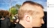 A firefighter rushes with semi-finished hairstyle...